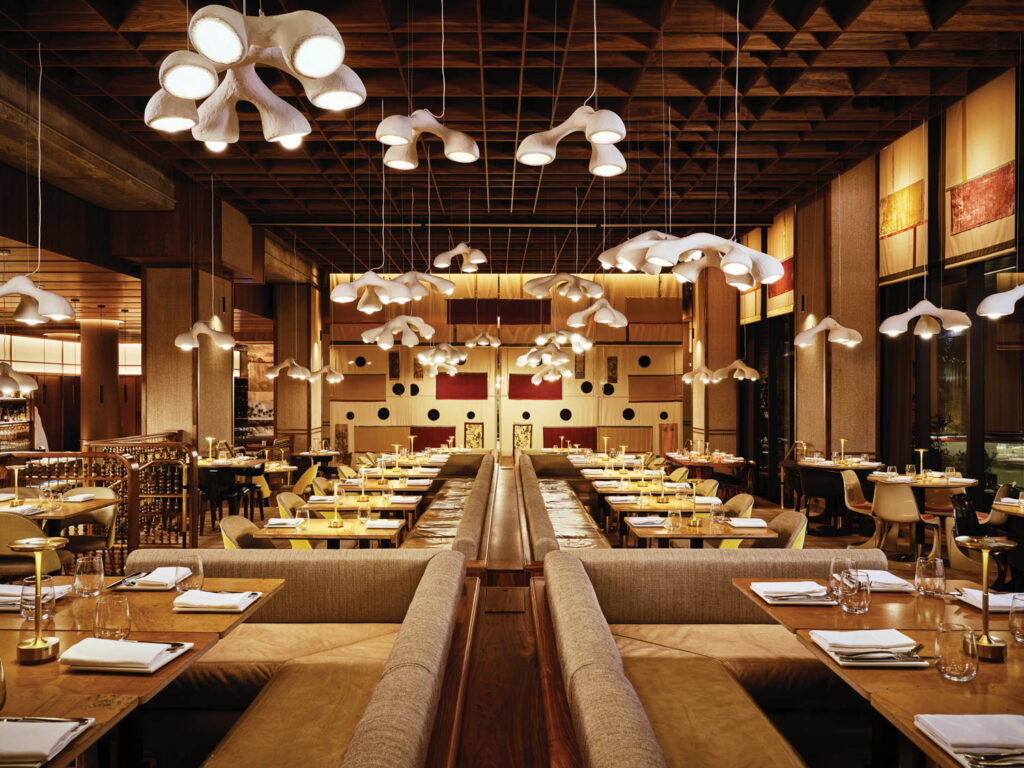 Stylish restaurant interior designed by Bamoo Interio – featuring contemporary seating, ambient lighting, and a warm, inviting atmosphere for an enhanced dining experience.