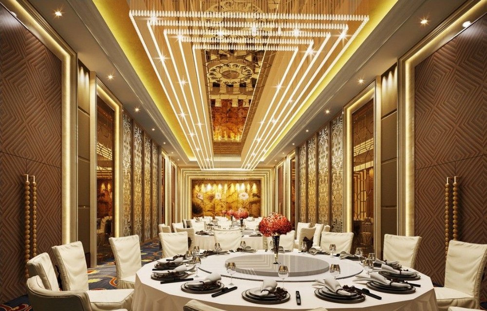 Premium banquet interior with chandelier lighting and decorative ceiling by Bamoo Interio